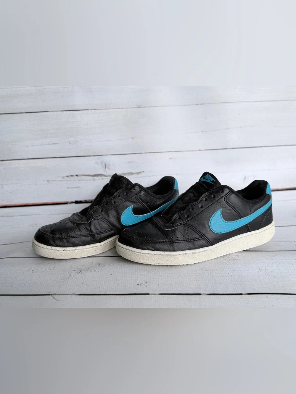 Nike Men’s Black Sneakers with Blue Swoosh